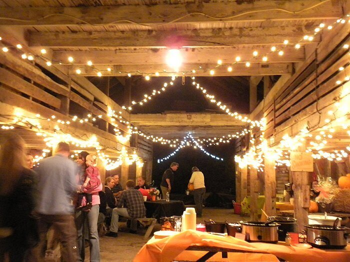 Knowledge Services’ employees enjoy the 2010 chili cook-off in an open-air barn.