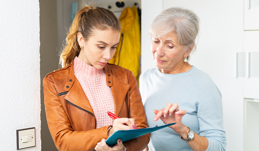 young-woman-taking-notes-with-older-woman