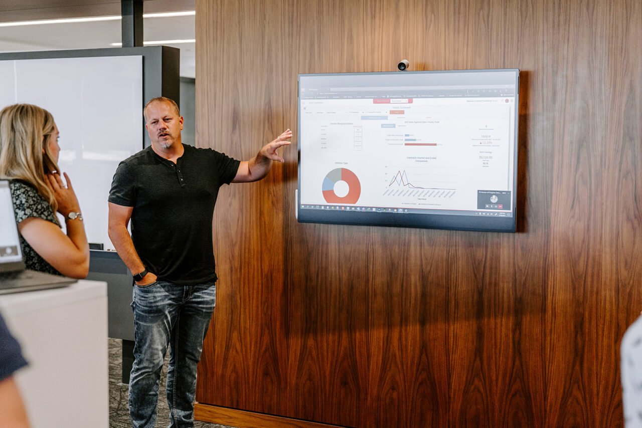 Image of man presenting to colleagues