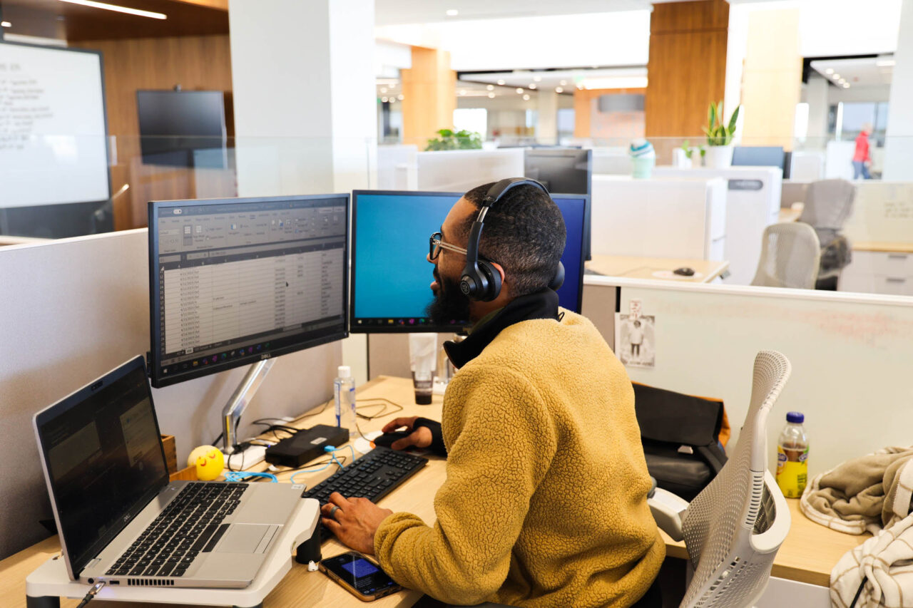 Image of man working at his workstation