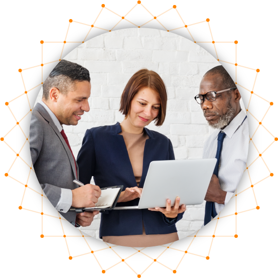 Image of three people discussing around a computer