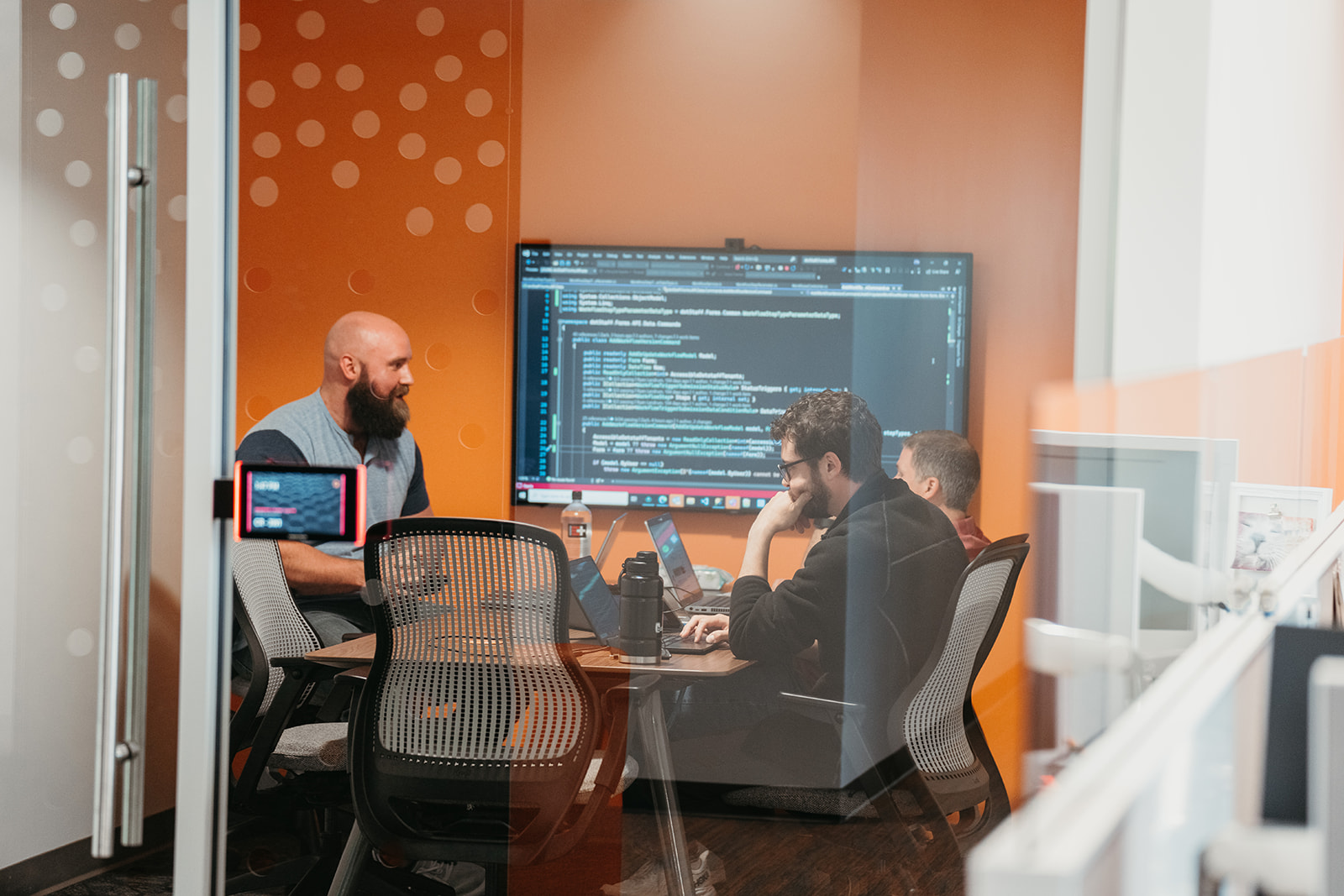 Image of two people working at a table and discussing